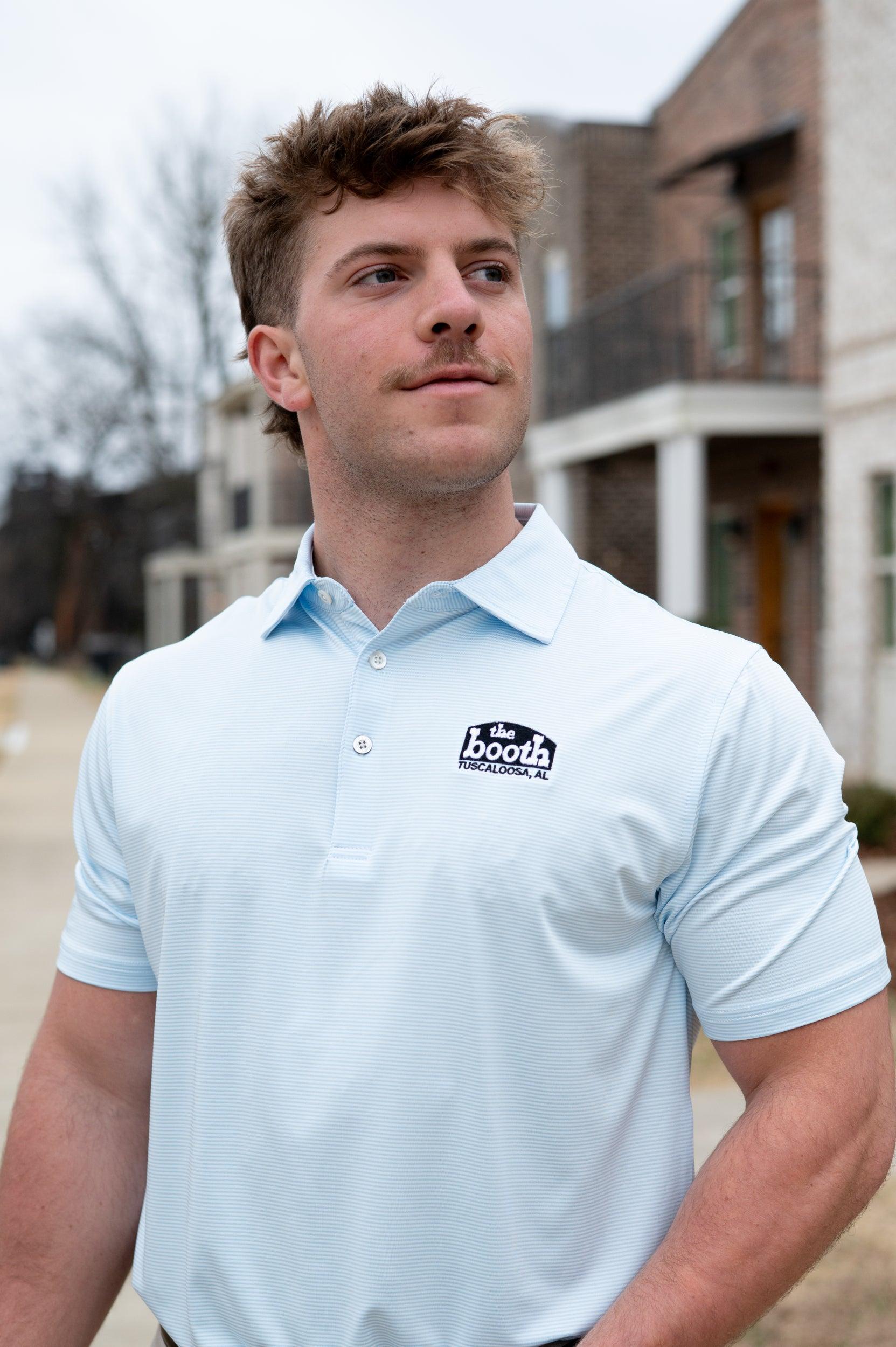 The Booth Light Blue Stripe Men’s Polo with The Booth Logo embroidered on the chest