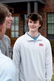 The Booth Light Blue Stripe Men’s Pullover with a Red The Booth Logo embroidered on the chest