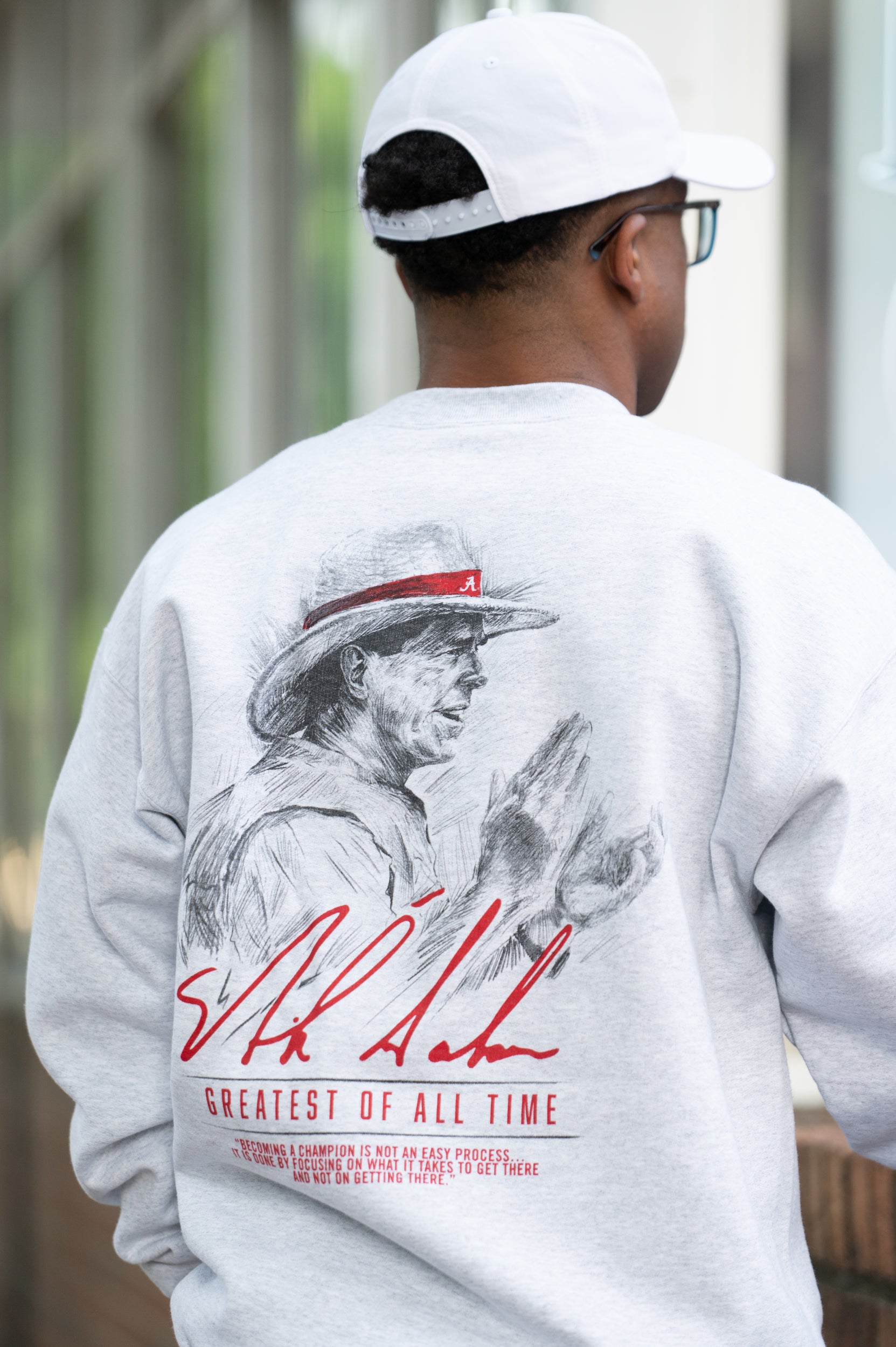 University of Alabama White Gildan Sweatshirt with an illustration of Nick Saban above his signature and Red text "Greatest Of All Time"
