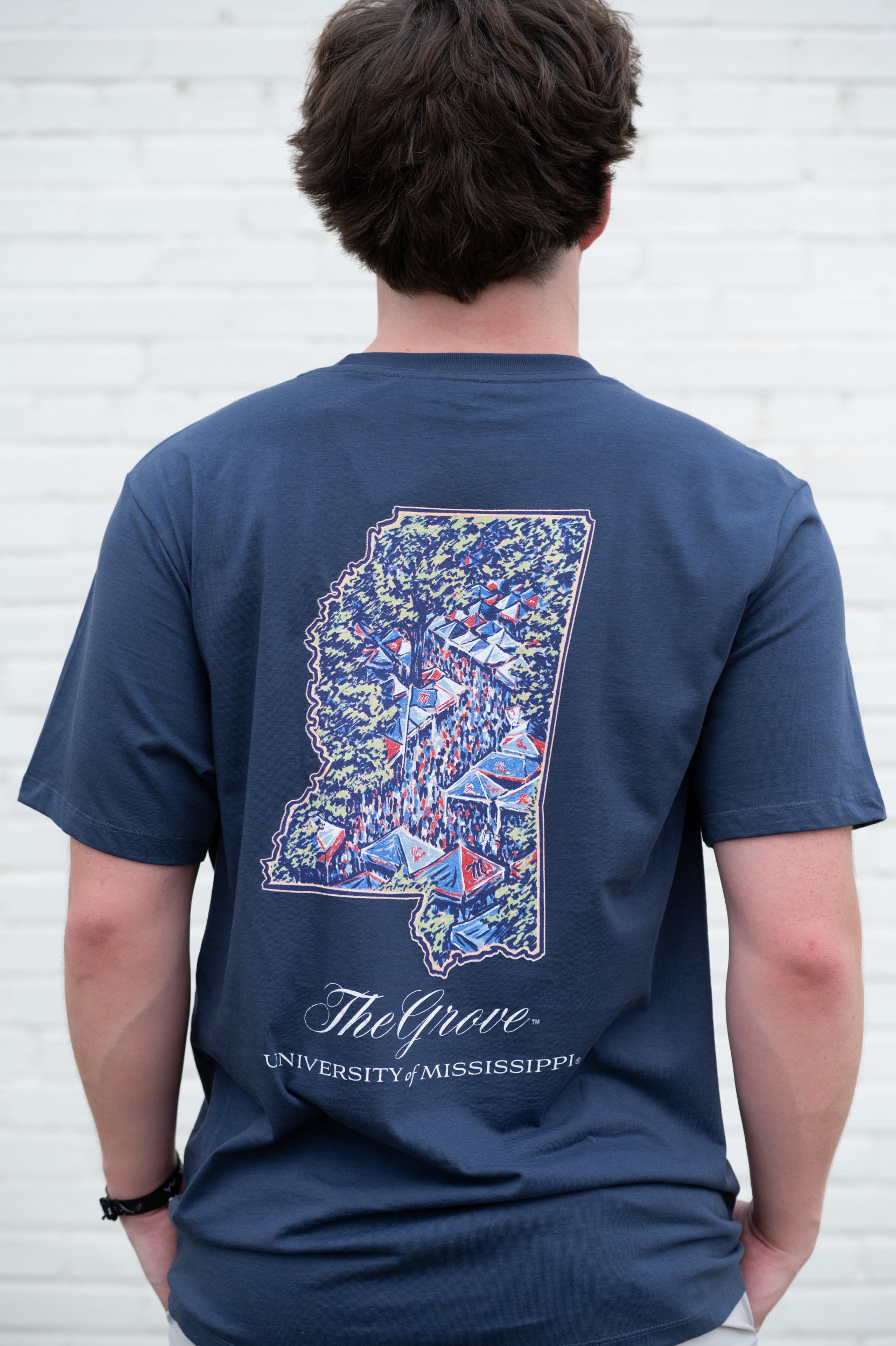 Ole Miss Navy T-Shirt with an outline of Mississippi and an image of The Grove during tailgating inside