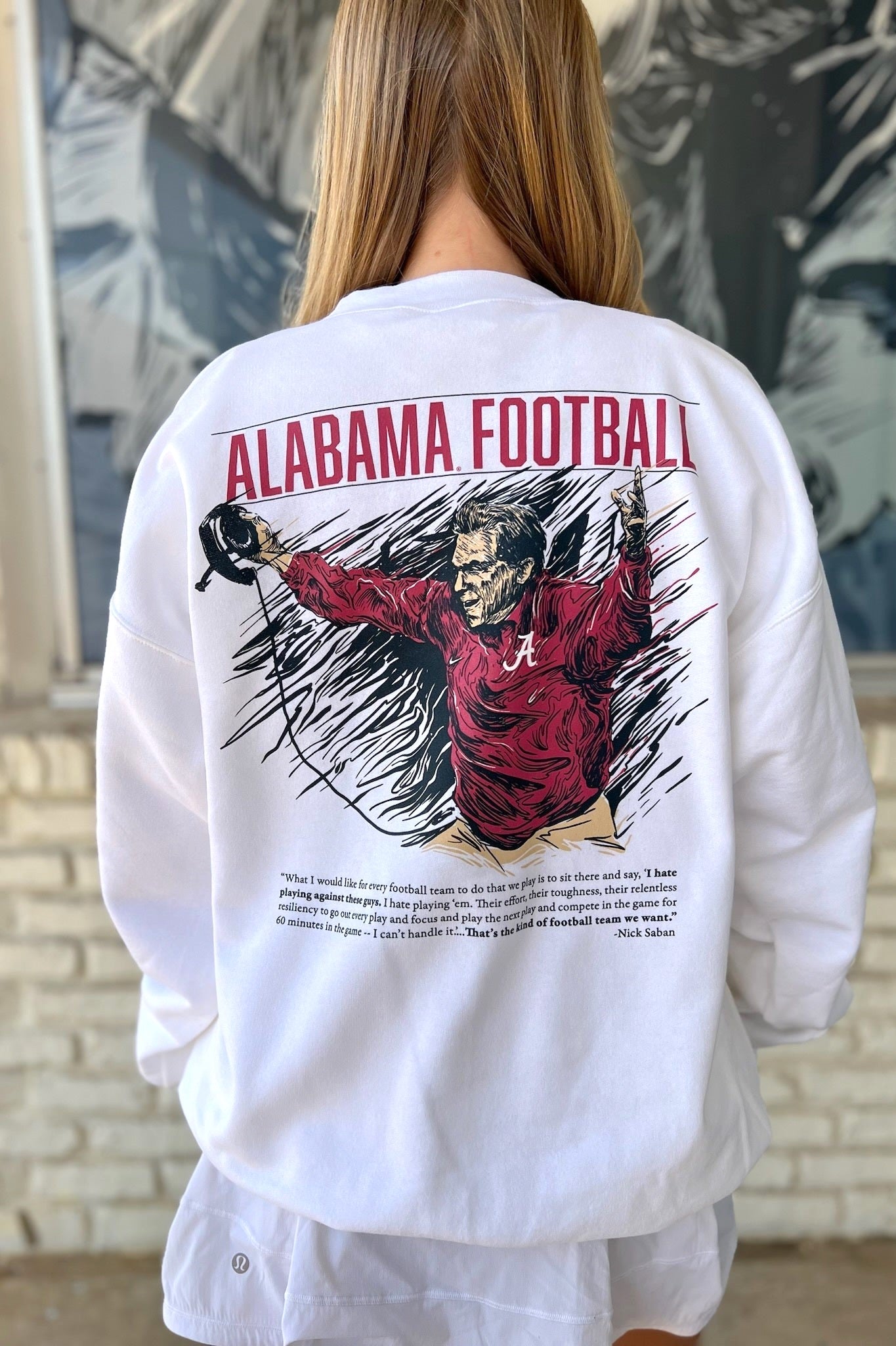 University of Alabama White The Philosophy Sweatshirt featuring an illustration of Nick Saban coaching above text reading his philosophy 
