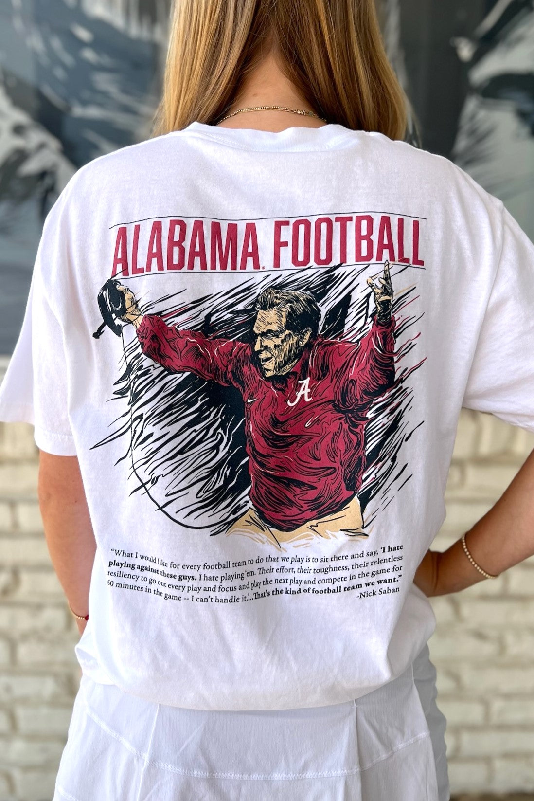 University of Alabama White The Philosophy T-Shirt featuring an illustration of Nick Saban coaching above text reading his philosophy