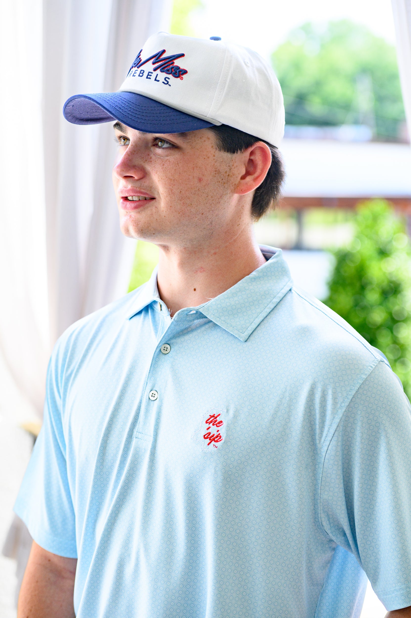 Ole Miss Blue Men’s Diamond Polo with an embroidered White outline of Mississippi and Red script “the ‘Sip”