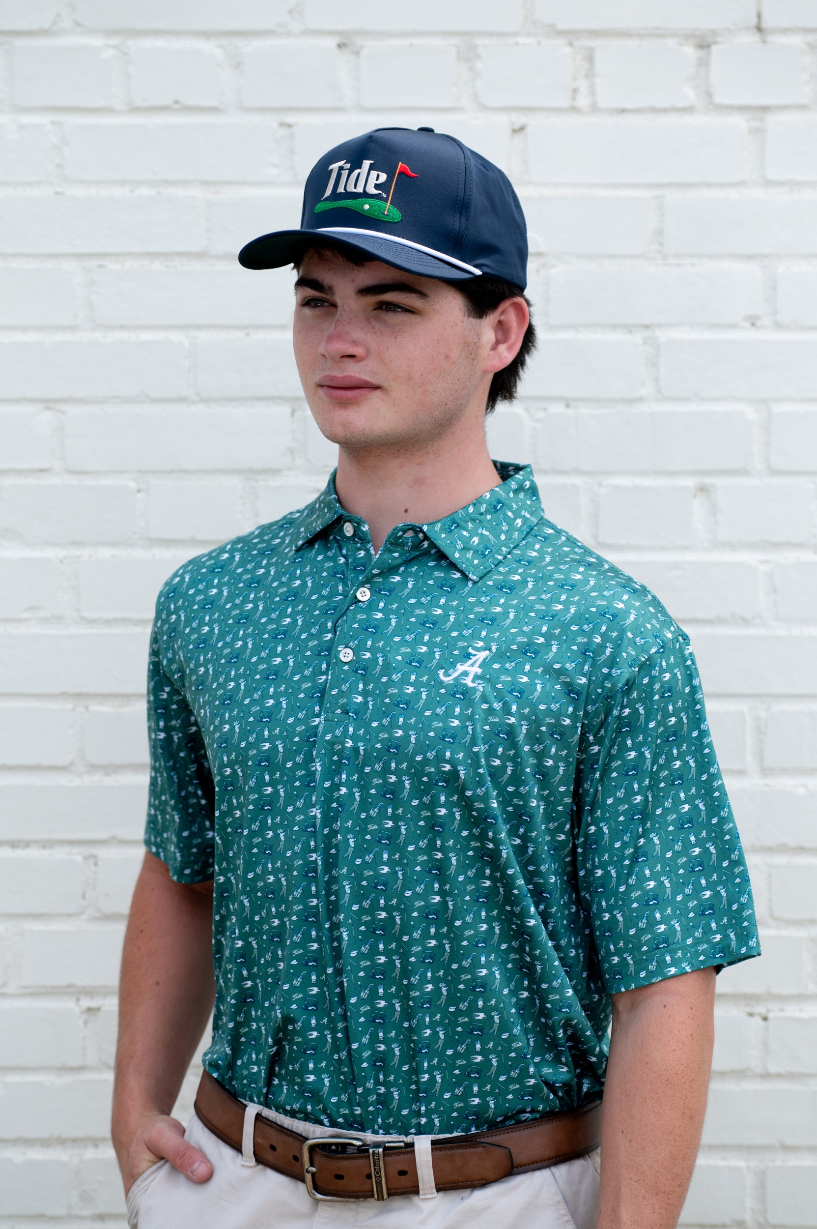 University of Alabama Navy Hat with a White Rope and White text “Tide” above an image of a golf hole