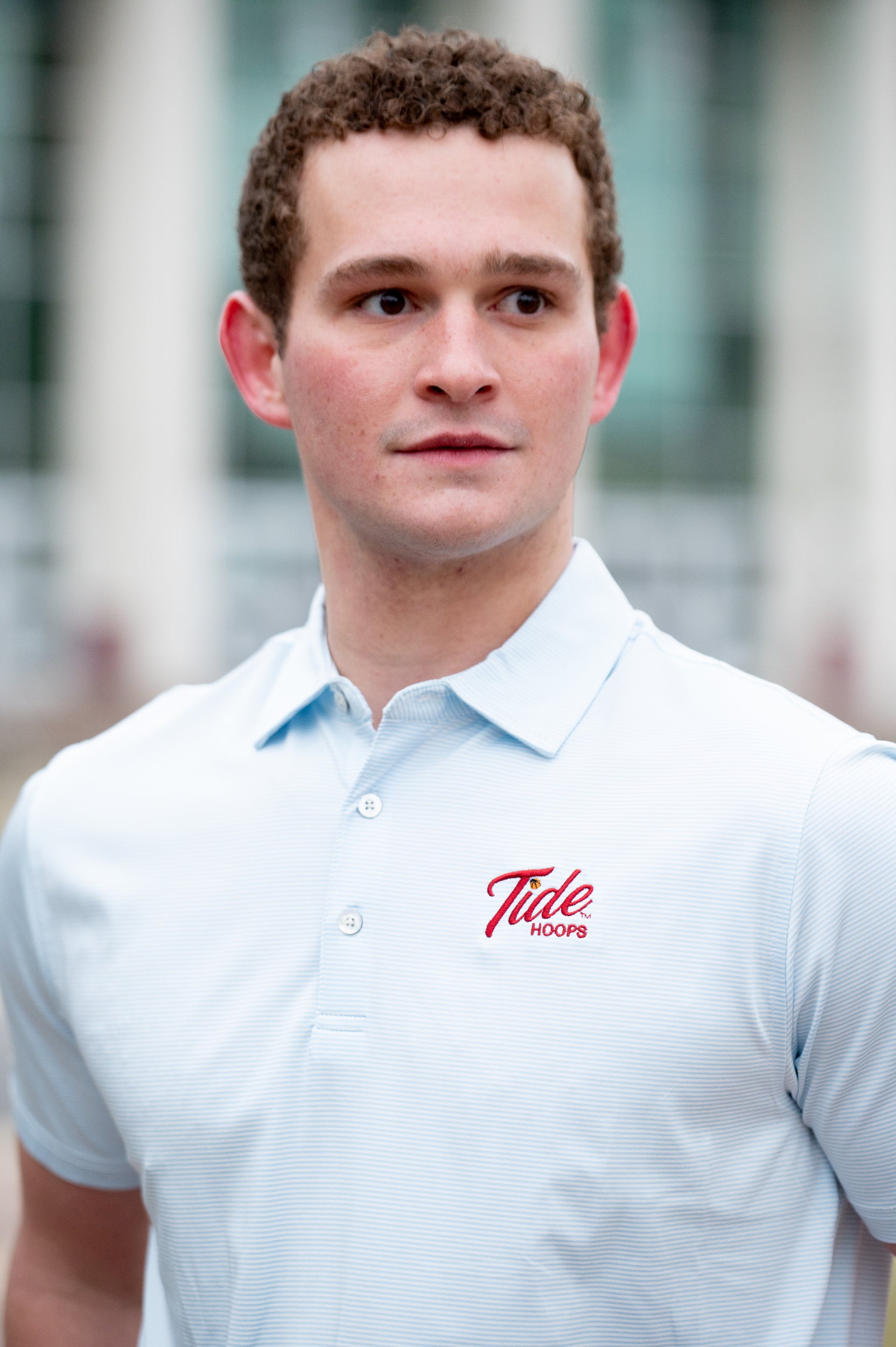 University of Alabama Men’s Light Blue Stripe Polo with the Tide Hoops Logo embroidered on the chest