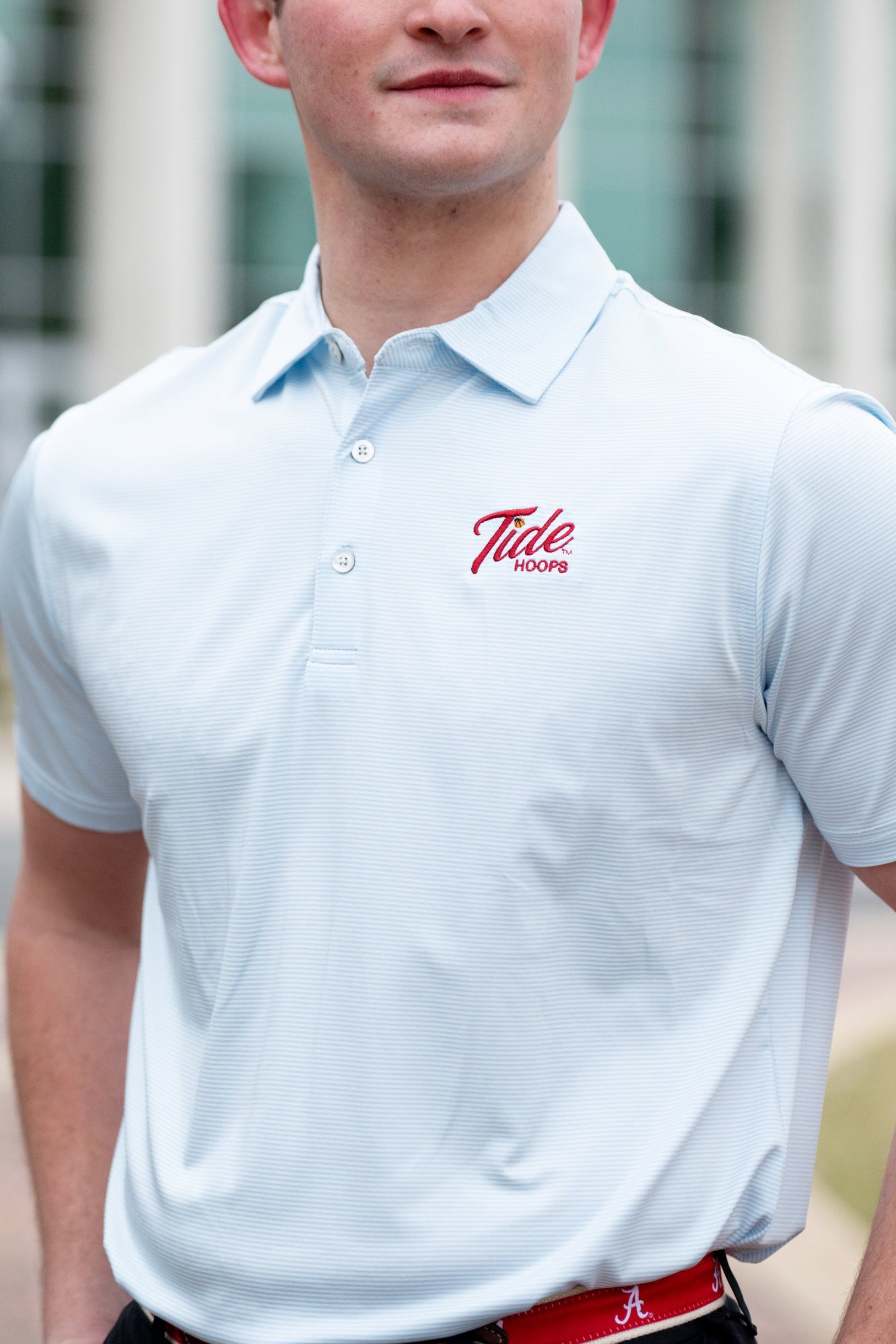 University of Alabama Men’s Light Blue Stripe Polo with the Tide Hoops Logo embroidered on the chest