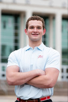 University of Alabama Men’s Light Blue Stripe Polo with the Tide Hoops Logo embroidered on the chest