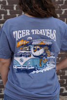 Auburn University Blue T-Shirt with 'Tiger Travels' text and an illustration of  Aubie in a VW Bus leaving the Auburn campus