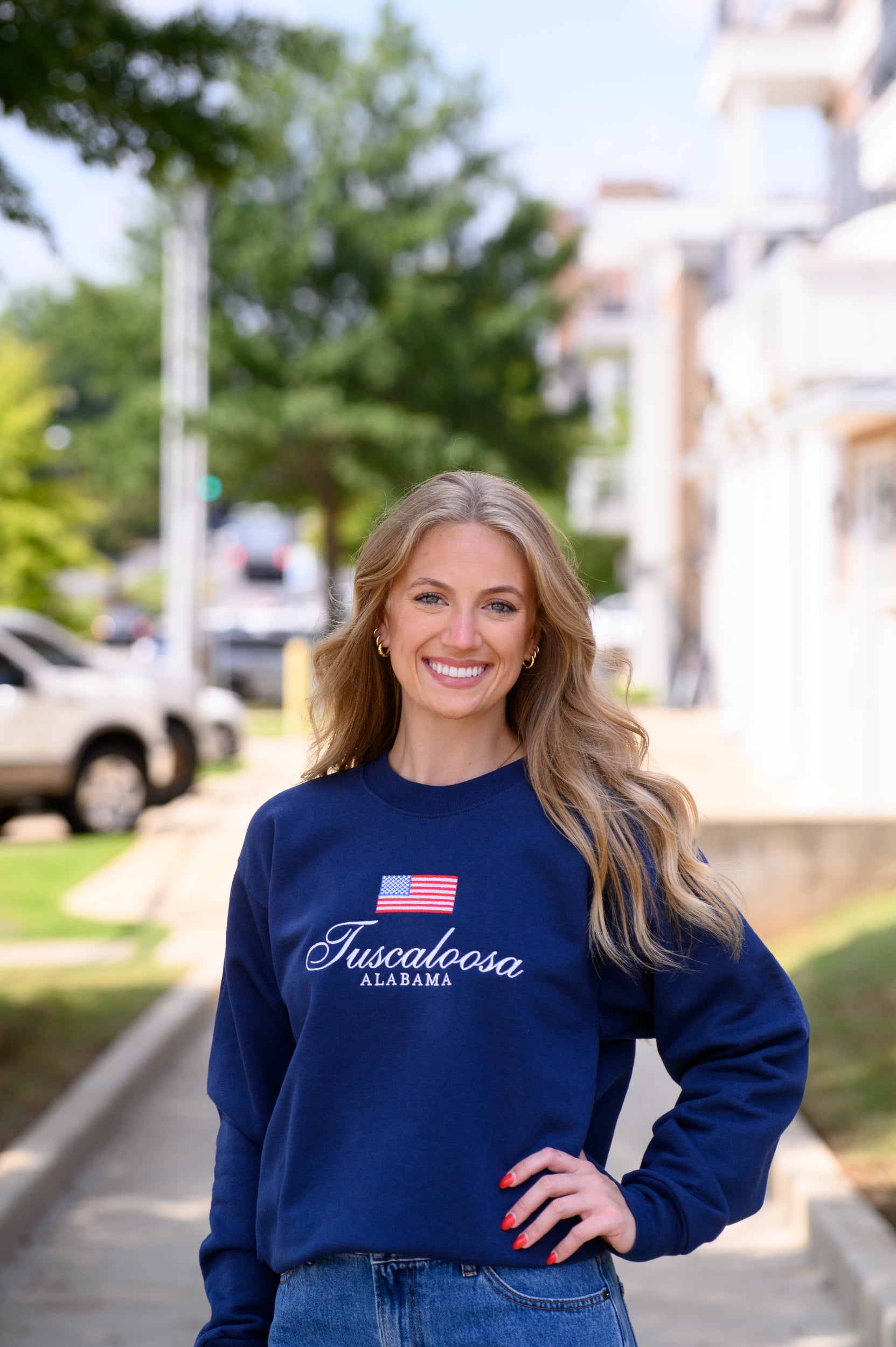 Navy Crewneck with an American Flag above White text “Tuscaloosa Alabama”