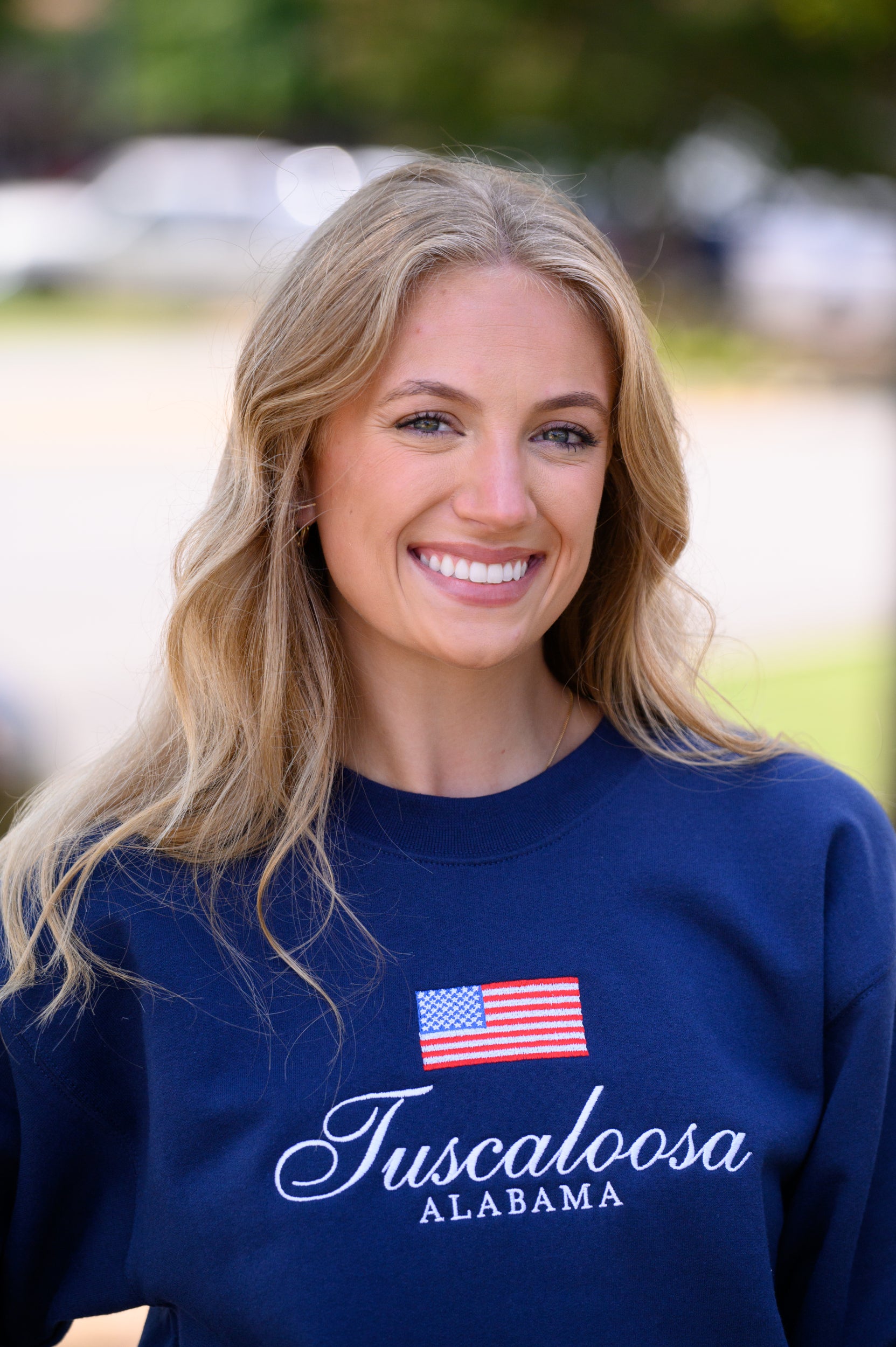 Navy Crewneck with an American Flag above White text “Tuscaloosa Alabama”