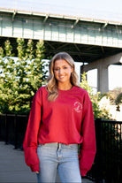 University of Alabama Red Sweatshirt with an image of the Tuska Statue underneath White text "Where Legends Are Made"