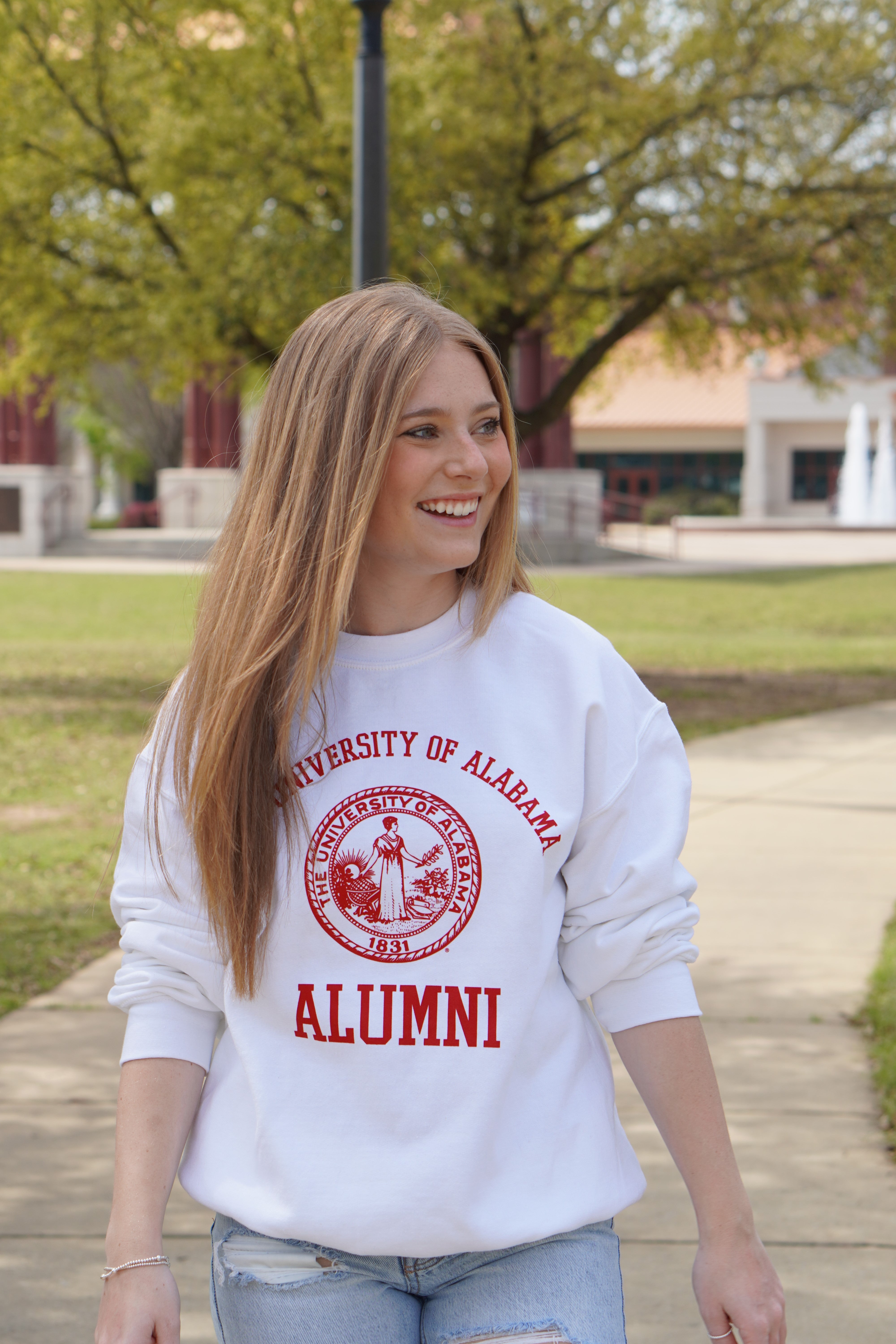 University of Alabama Light Grey Alumni Sweatshirt with Red text "University of Alabama" above the Red Alumni Seal and Red text "Alumni" below