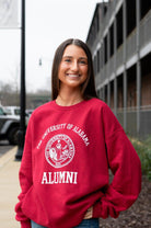 University of Alabama Red Alumni Sweatshirt with White text "University of Alabama" above the White Alumni Seal and White text "Alumni" below