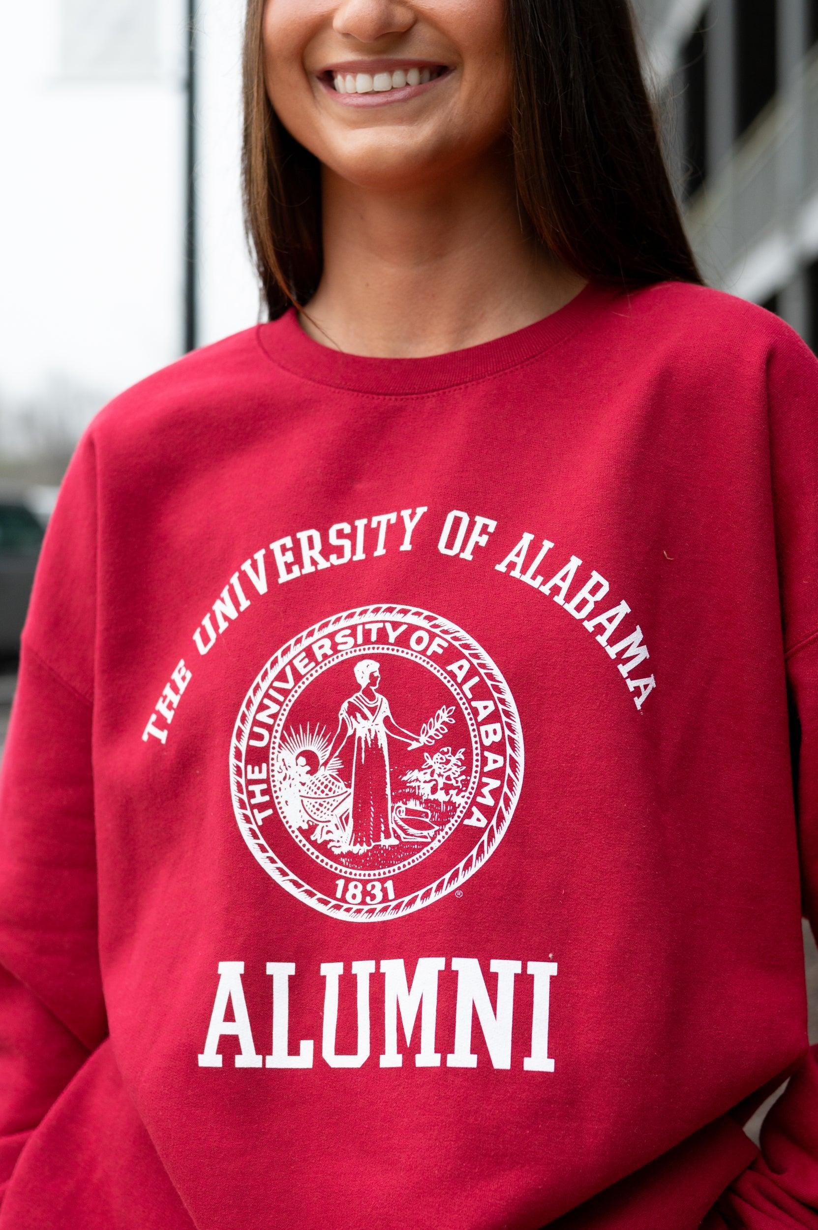 University of Alabama Red/Light Grey Alumni Sweatshirt with White text "University of Alabama" above the White Alumni Seal and White text "Alumni" below