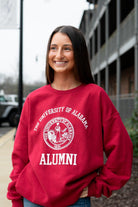 University of Alabama Red Alumni Sweatshirt with White text "University of Alabama" above the White Alumni Seal and White text "Alumni" below