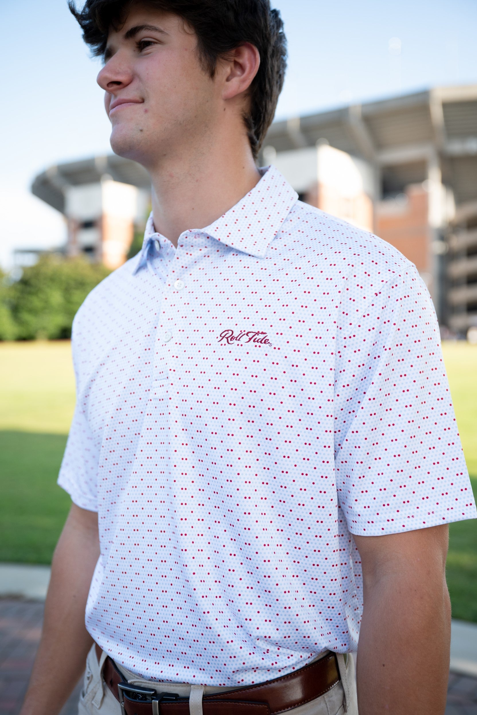 University of Alabama White Men's Dot Polo with a pattern of Light Blue and Red dots and Red script "Roll Tide" embroidery