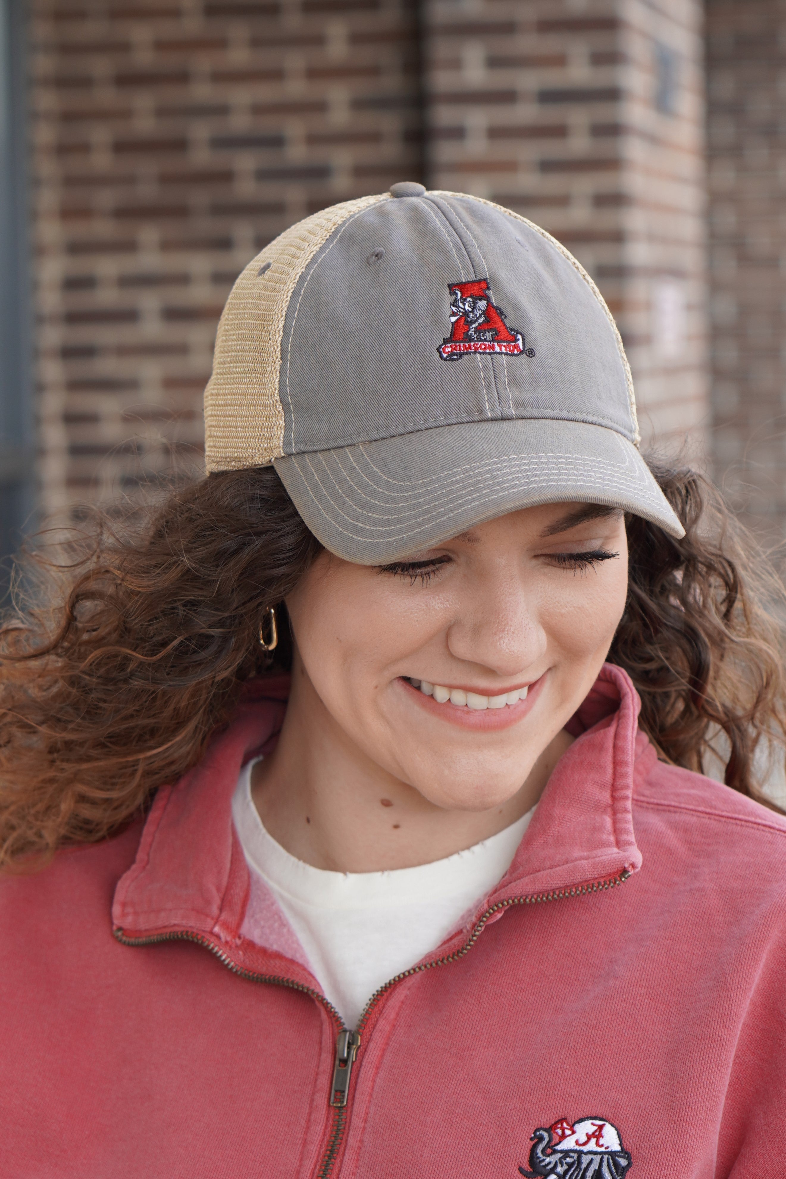 Vintage A Alabama Football Trucker Hat on a female model
