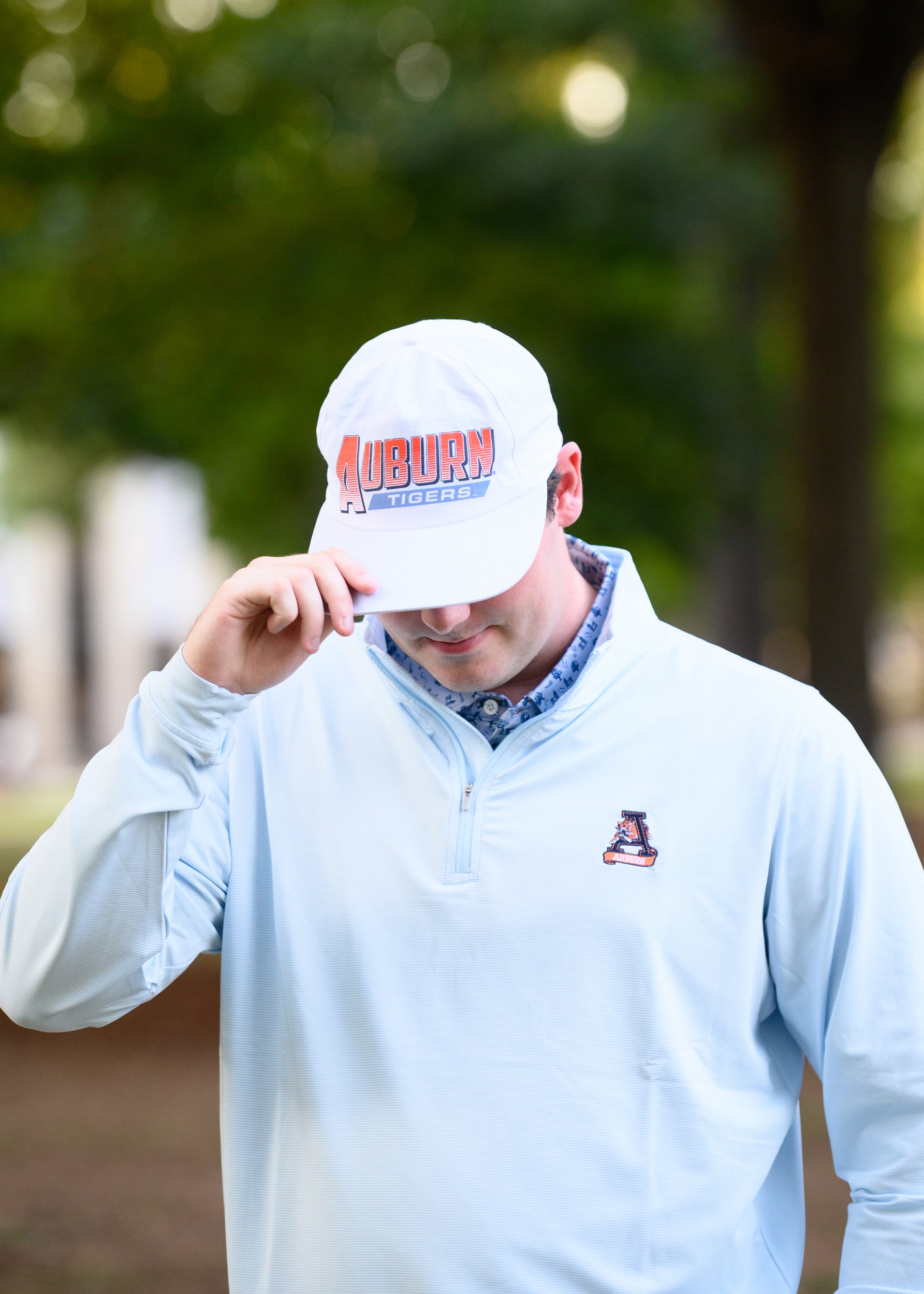 Auburn University White Hat with Orange text "Auburn" above a Blue Stripe with White text "Tigers"
