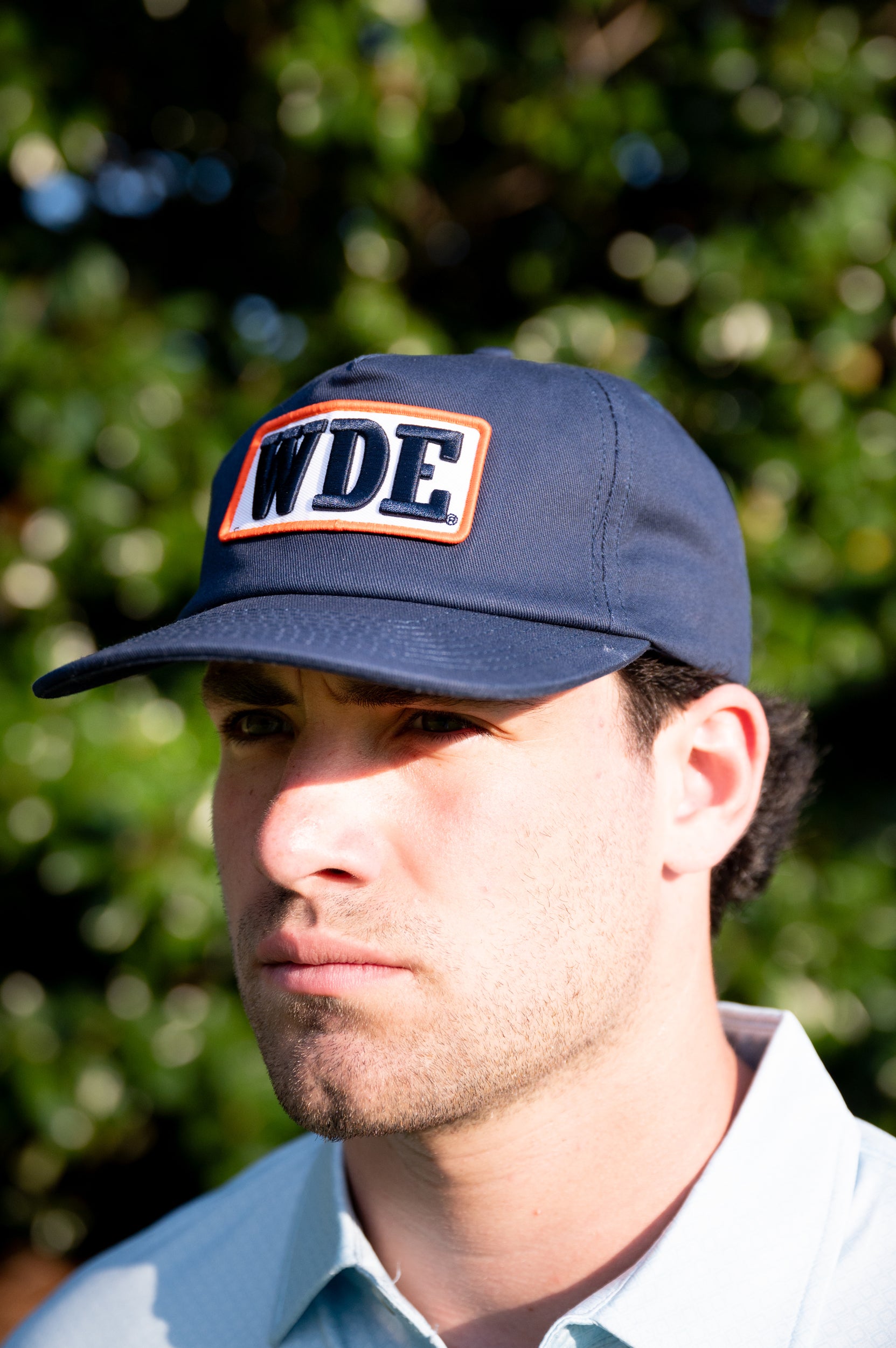 Auburn University Blue Snapback Hat featuring a White patch with Navy letters "WDE"