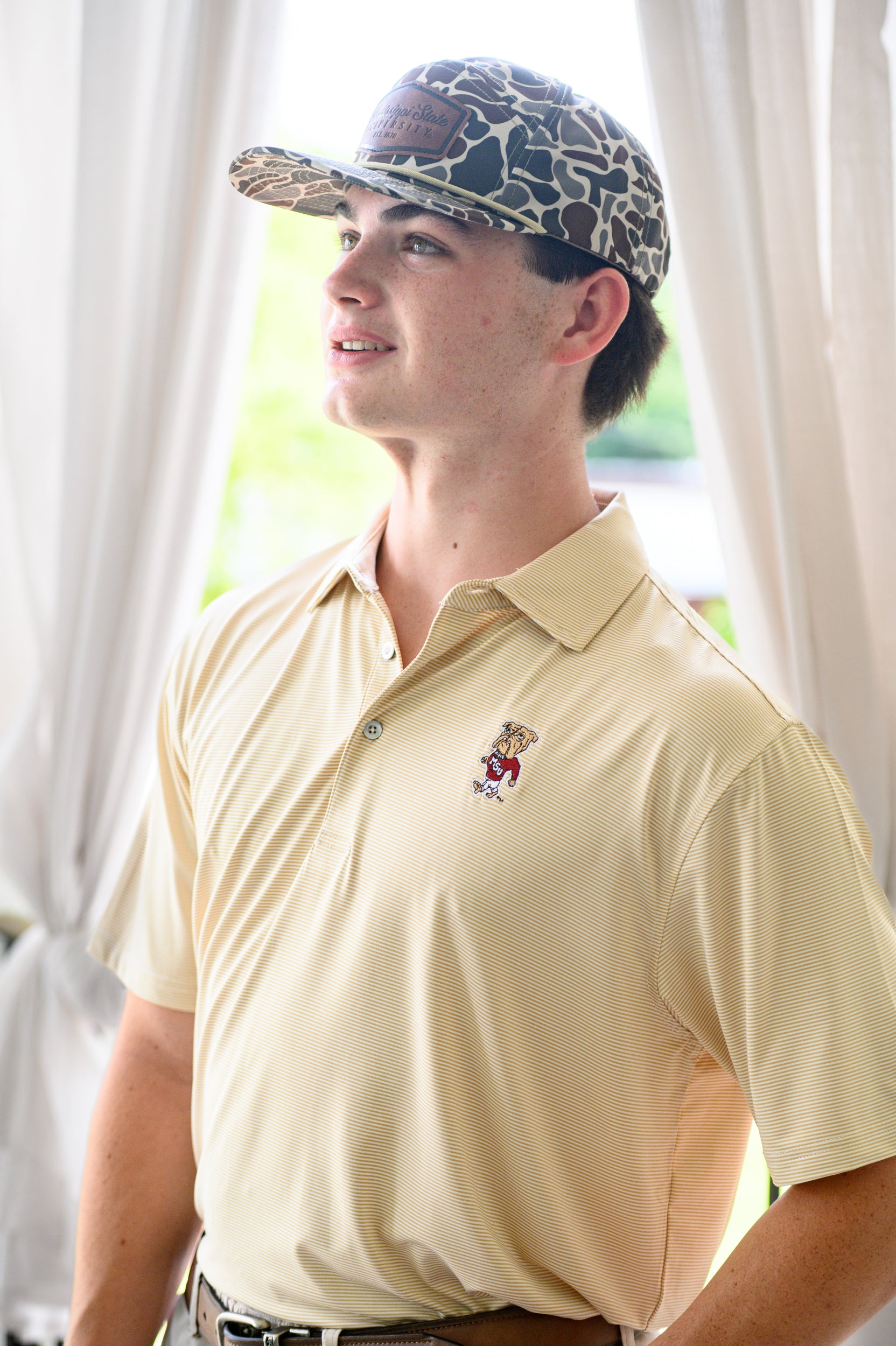 Mississippi State Tan Men’s Stripe Polo with the Walking Bully Logo embroidery