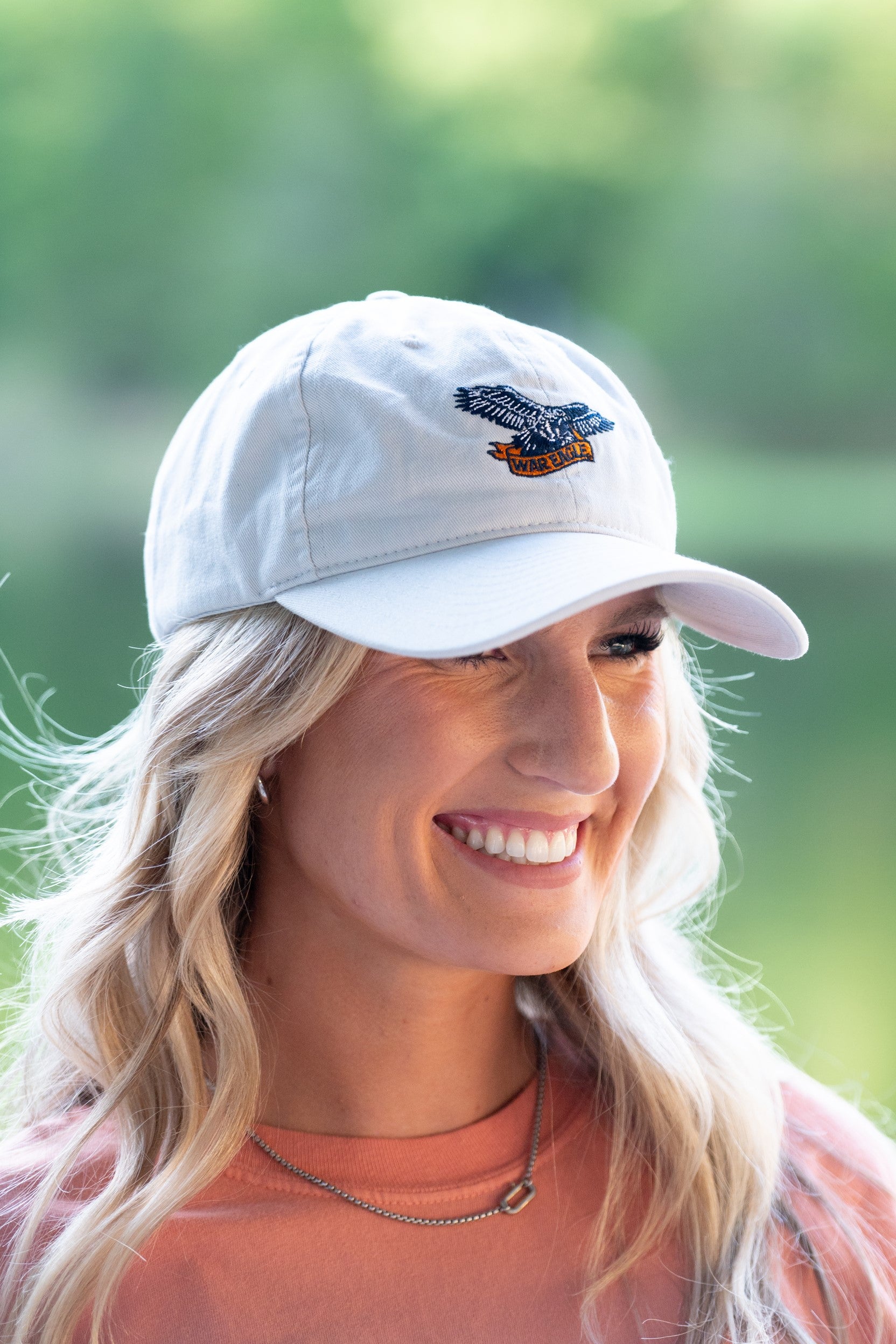 Auburn University White Dad Hat with a blue embroidered logo of the War Eagle Banner.