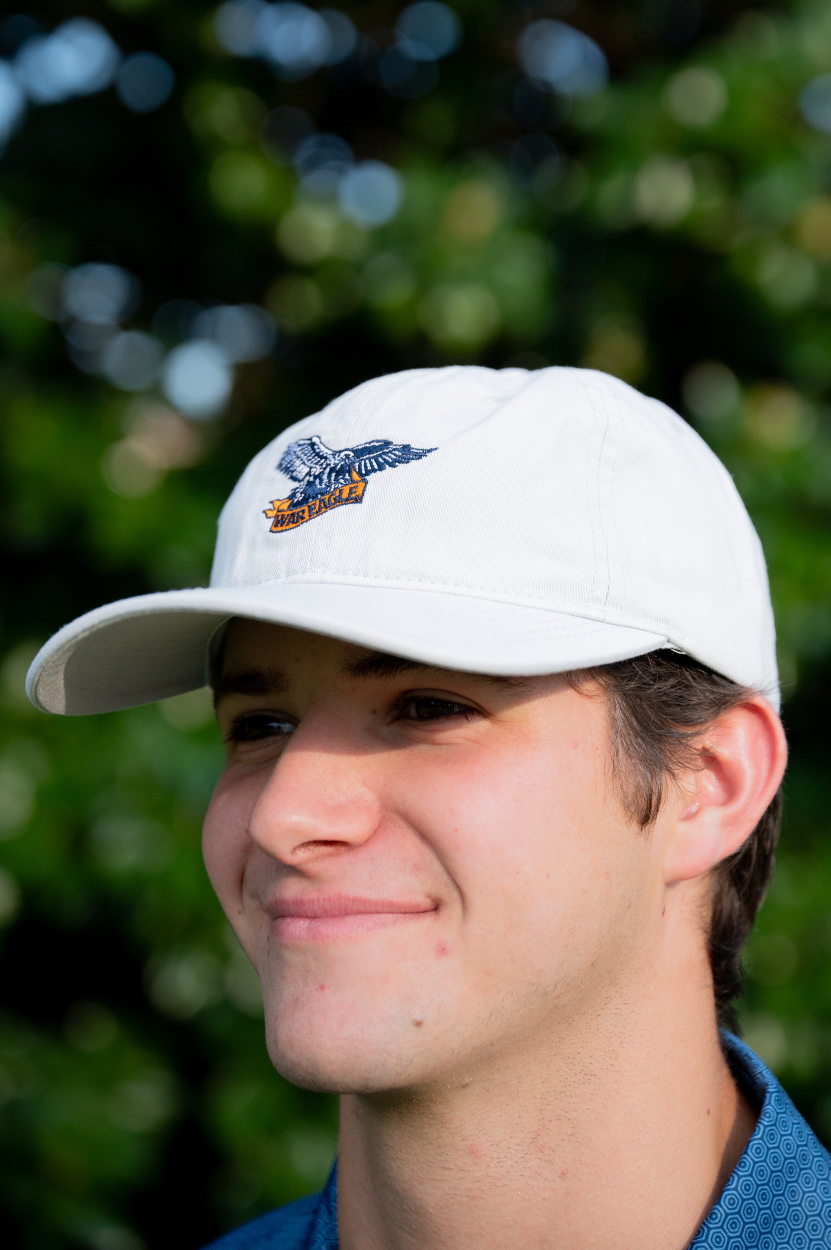 Auburn University White Dad Hat with a blue embroidered logo of the War Eagle Banner.