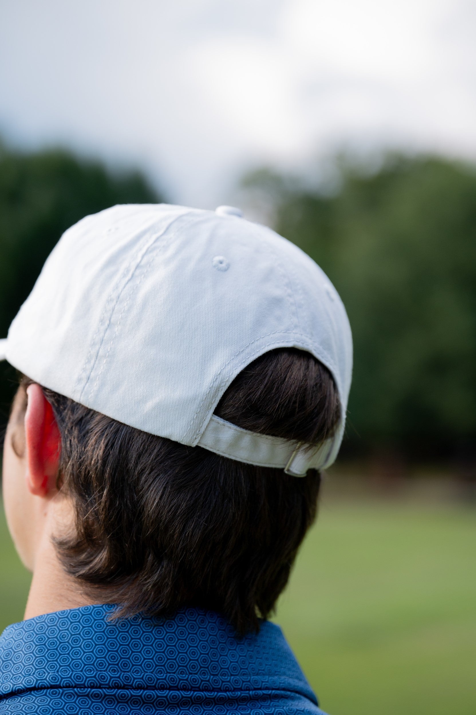 Auburn University White Dad Hat with a blue embroidered logo of the War Eagle Banner.