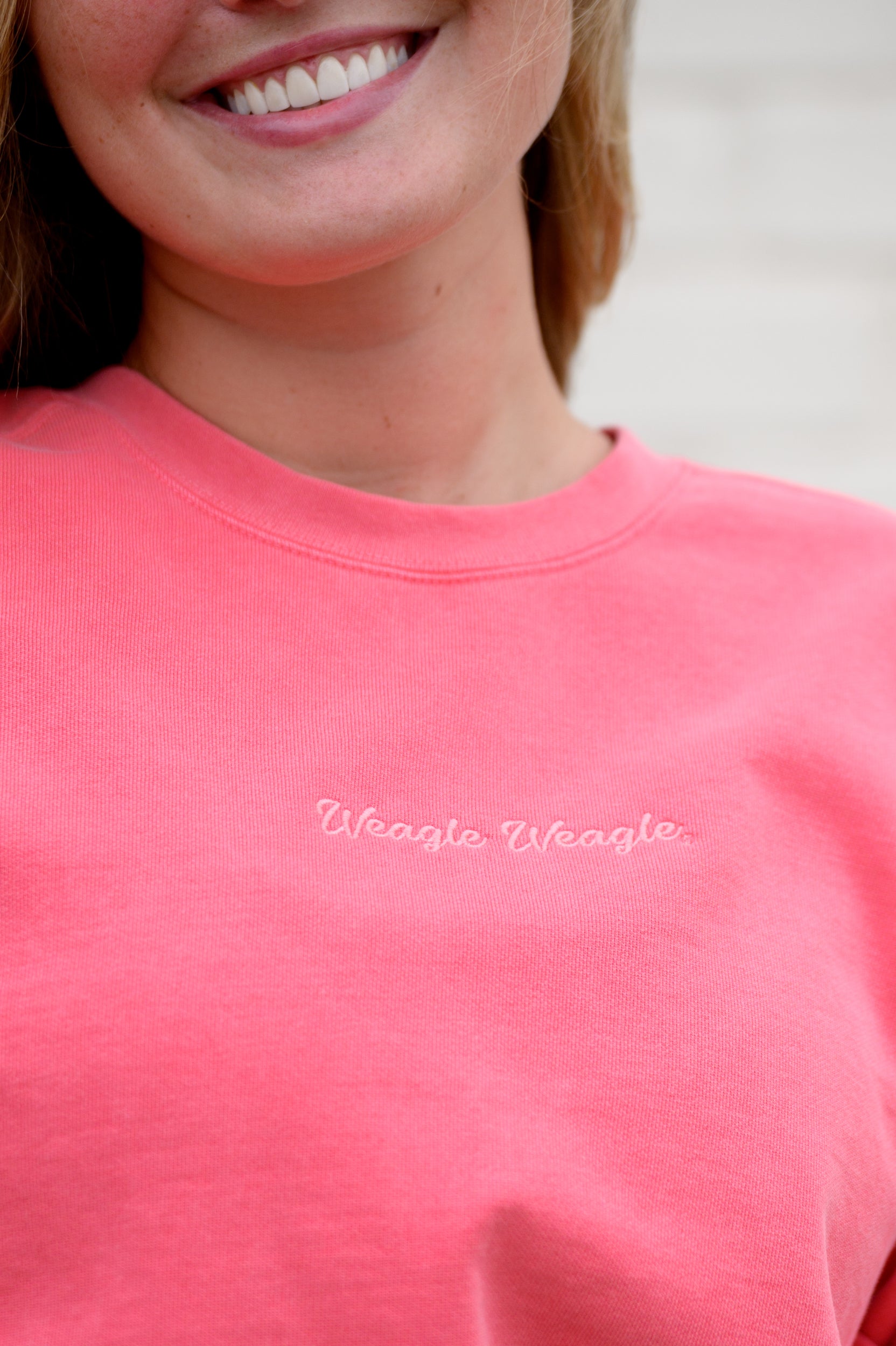 Auburn University Coral Ladies' Sweatshirt with Coral embroidered text "Weagle Weagle”