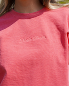 Auburn University Coral Ladies' Sweatshirt with Coral embroidered text "Weagle Weagle”