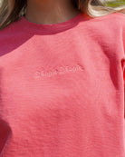 Auburn University Coral Ladies' Sweatshirt with Coral embroidered text "Weagle Weagle”