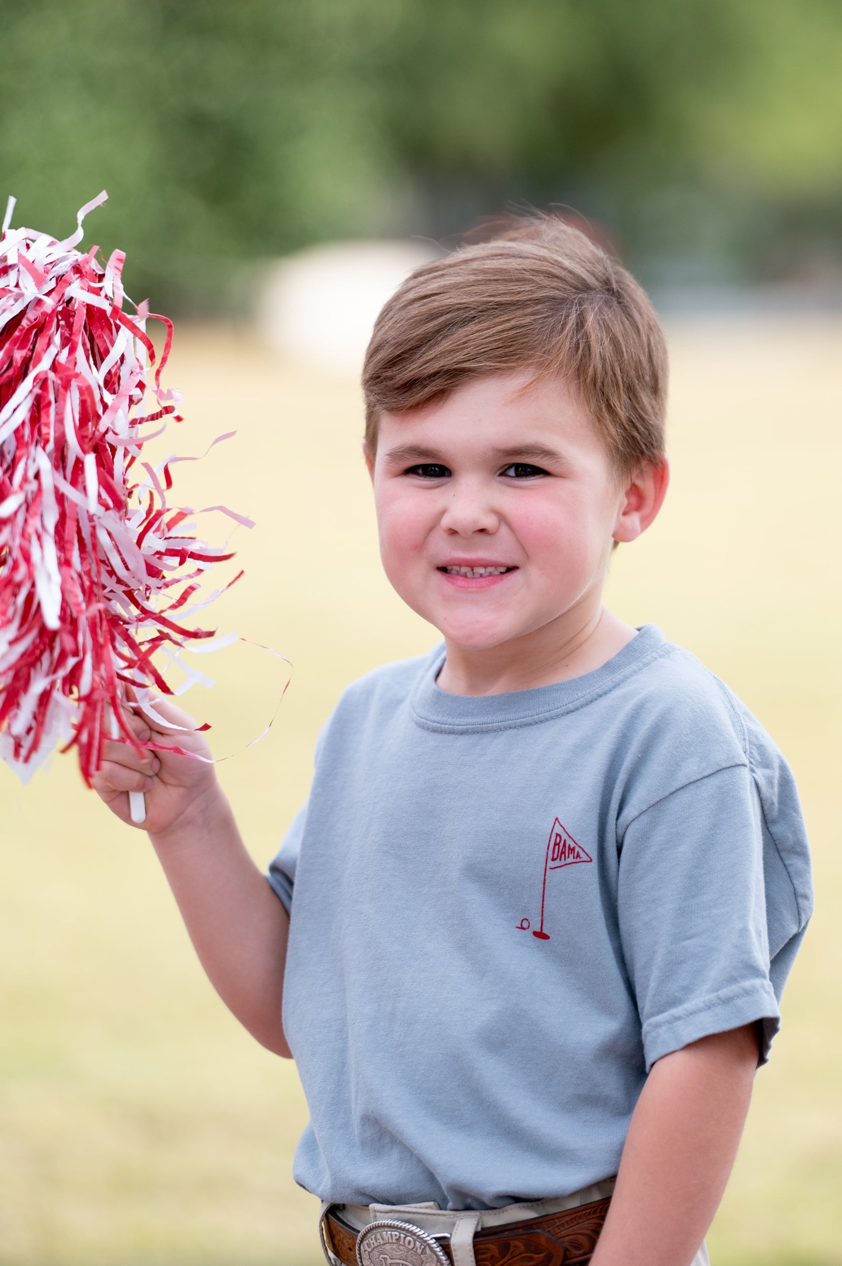 University of Alabama Blue Youth T-Shirt with a small, Red golf flag with "UA" inside