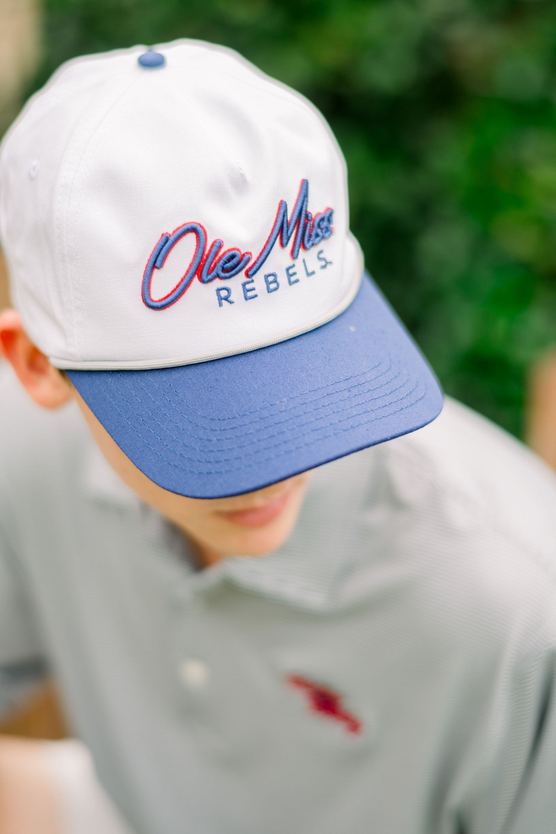 Ole Miss White and Navy Hat with Navy embroidery “Ole Miss” and Navy text “Rebels”