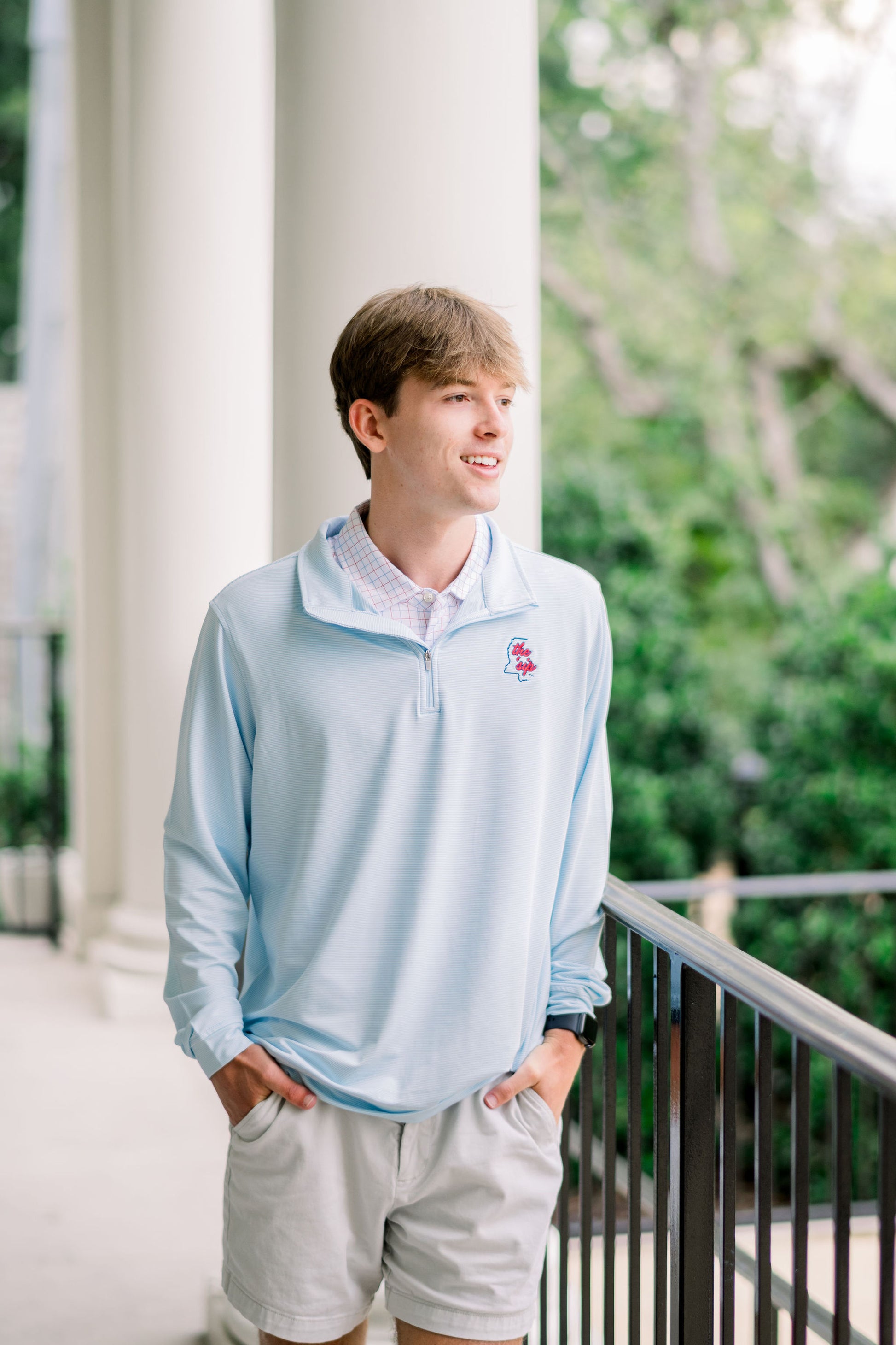 Ole Miss Light Blue ¼ Zip Pullover with text “The ‘Sip” inside of an outline of Mississippi embroidered on the left chest