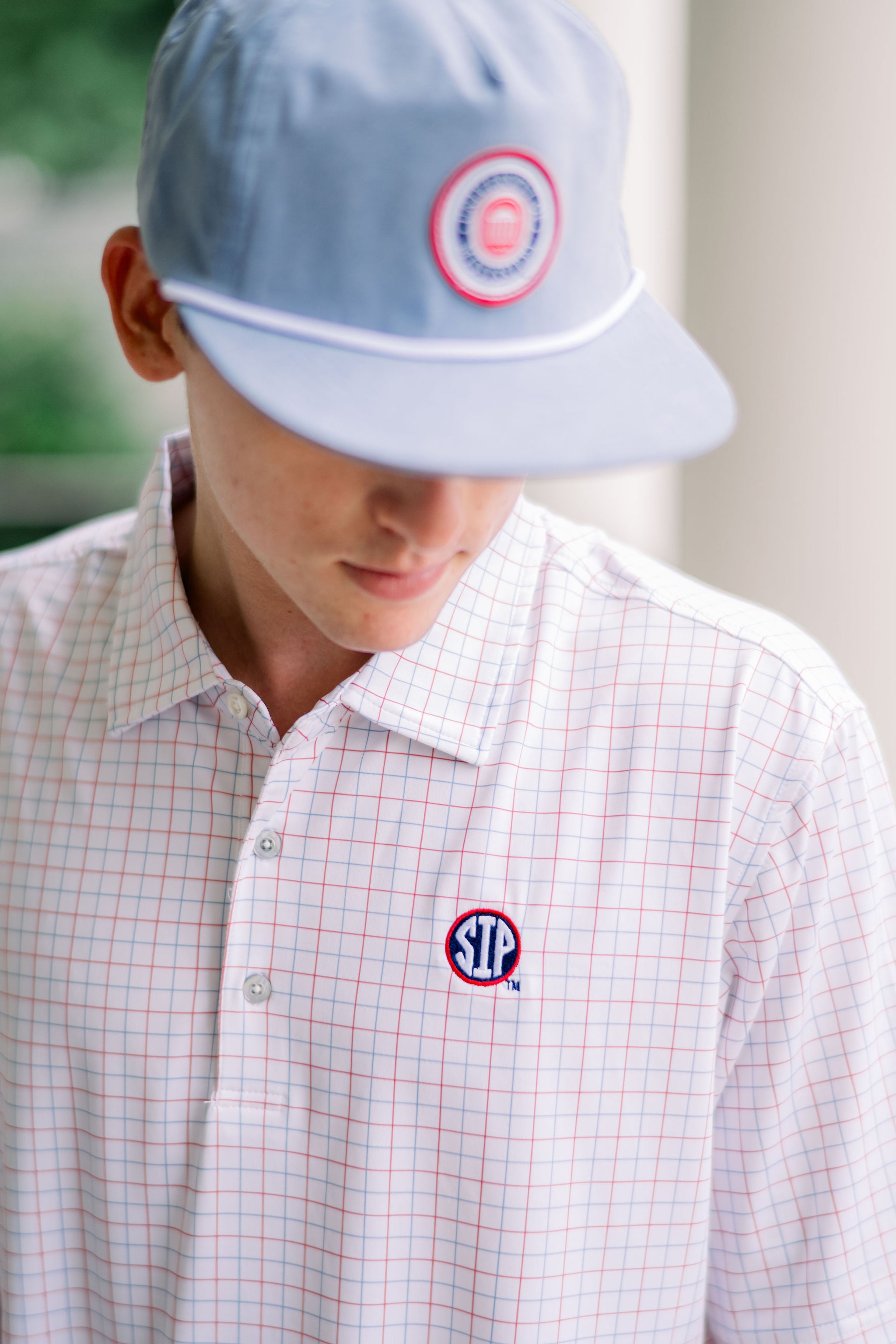 Ole Miss Windowpane Polo with the SIP Circle Logo embroidered on the left chest