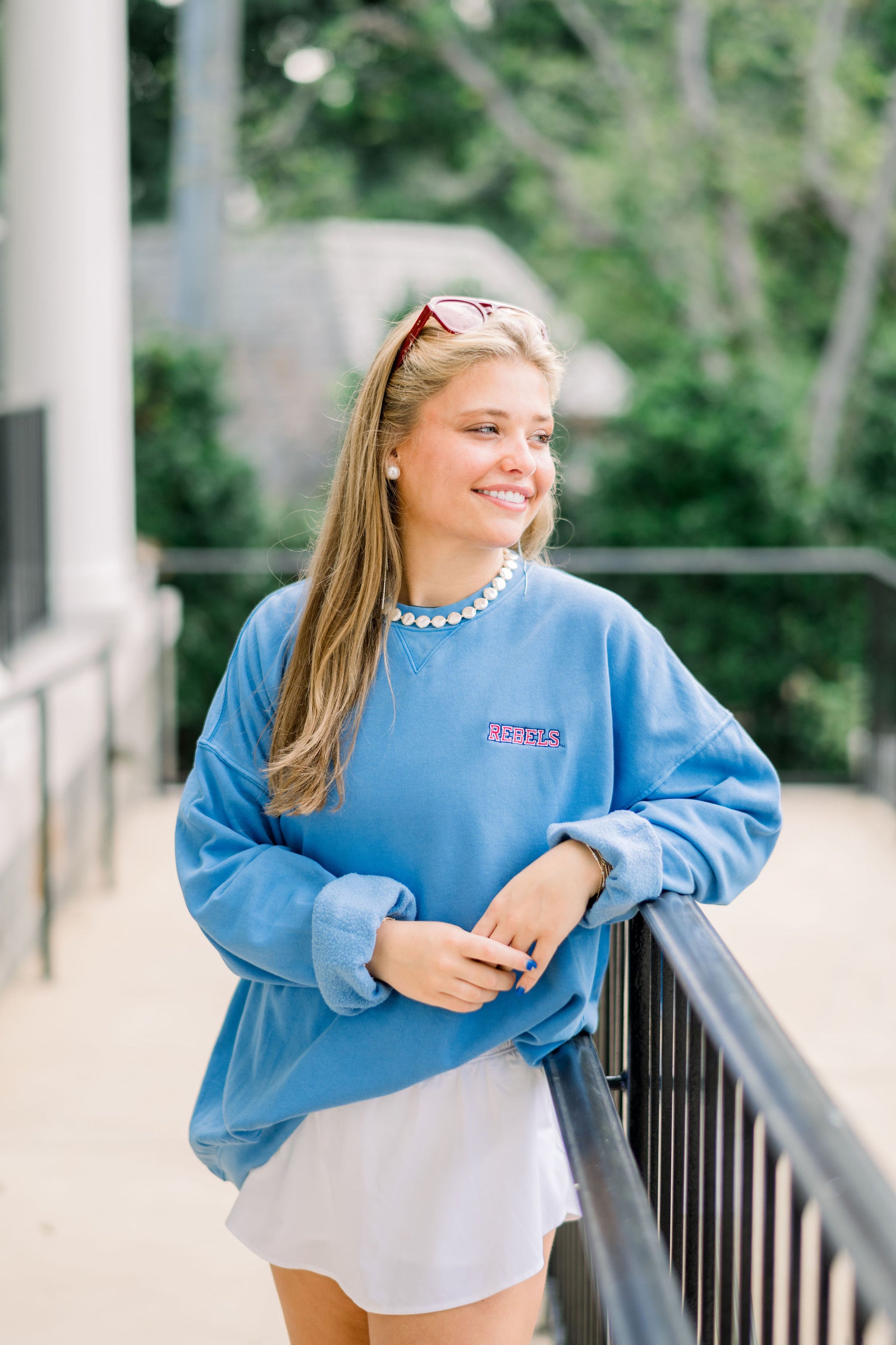 Ole Miss Blue Crewneck with the “Rebels” logo embroidered in Red on the left chest