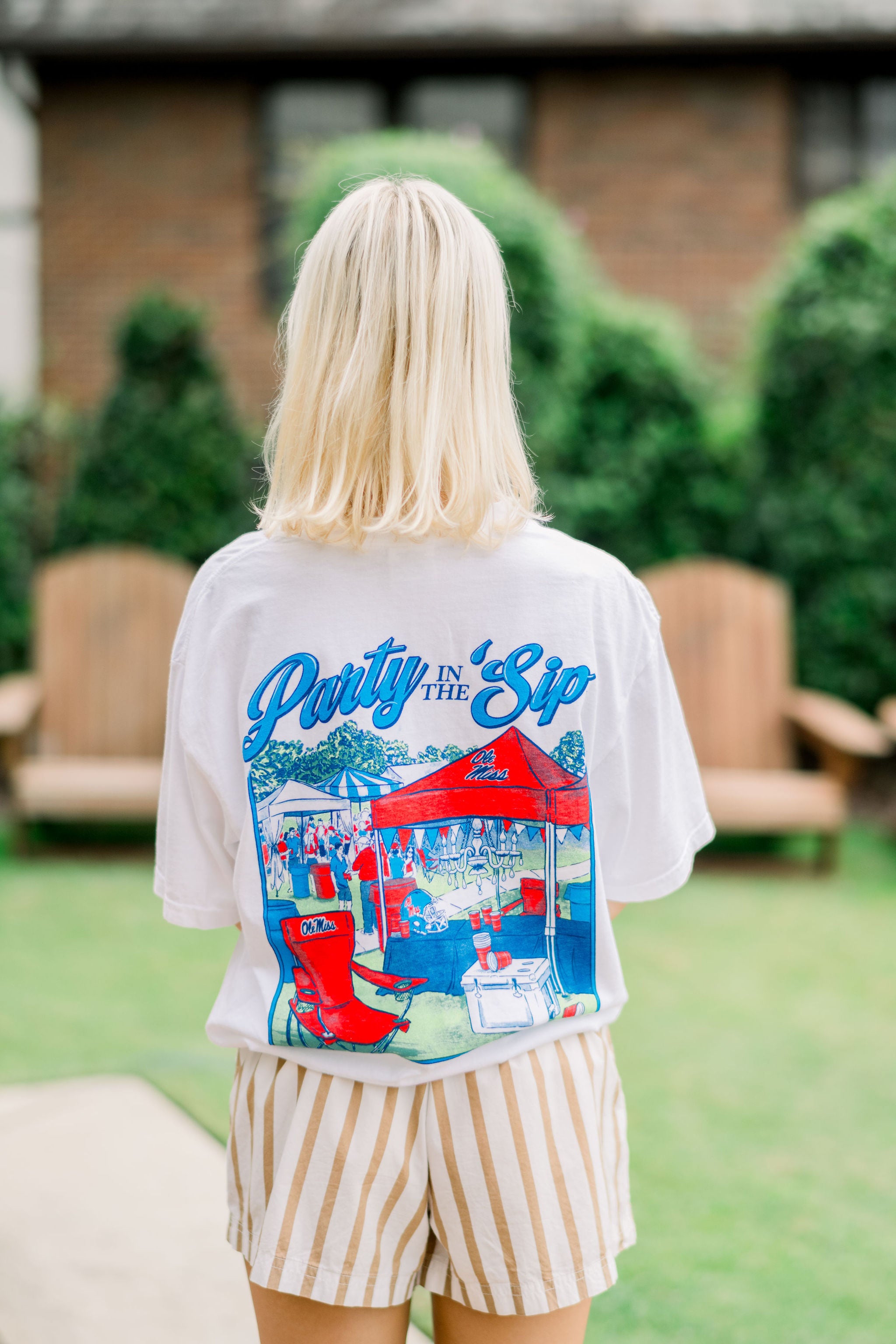 White t-shirt with 'Party in the Sip' graphic design on a white background