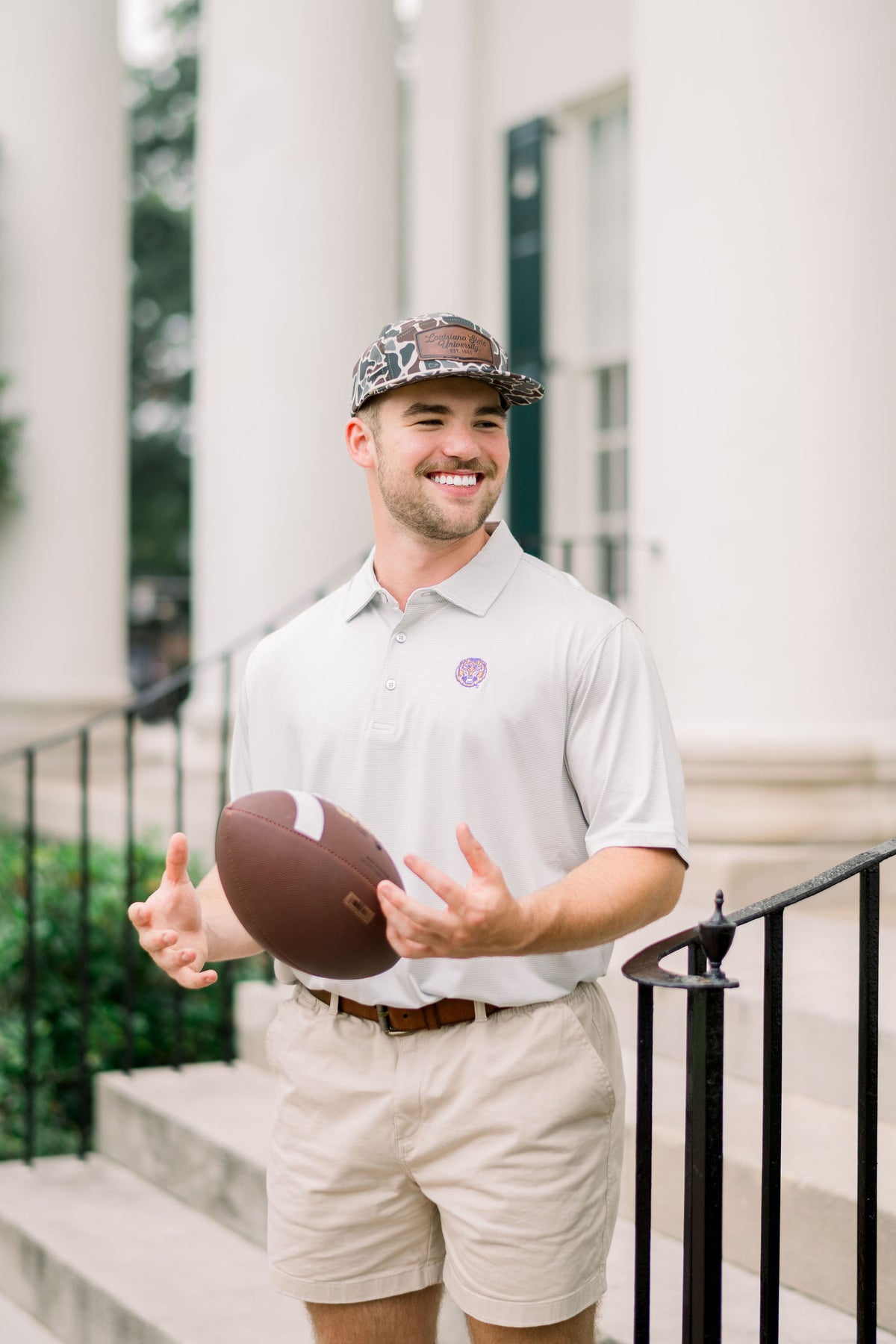 LSU Grey Stripe Men’s Polo with embroidery of a roaring Yellow and Purple Tiger