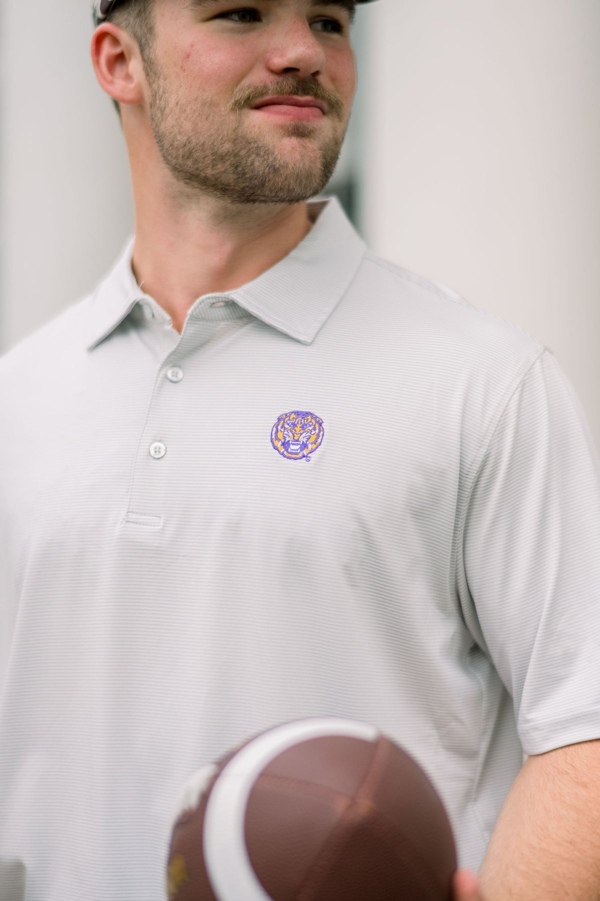 LSU Grey Stripe Men’s Polo with embroidery of a roaring Yellow and Purple Tiger