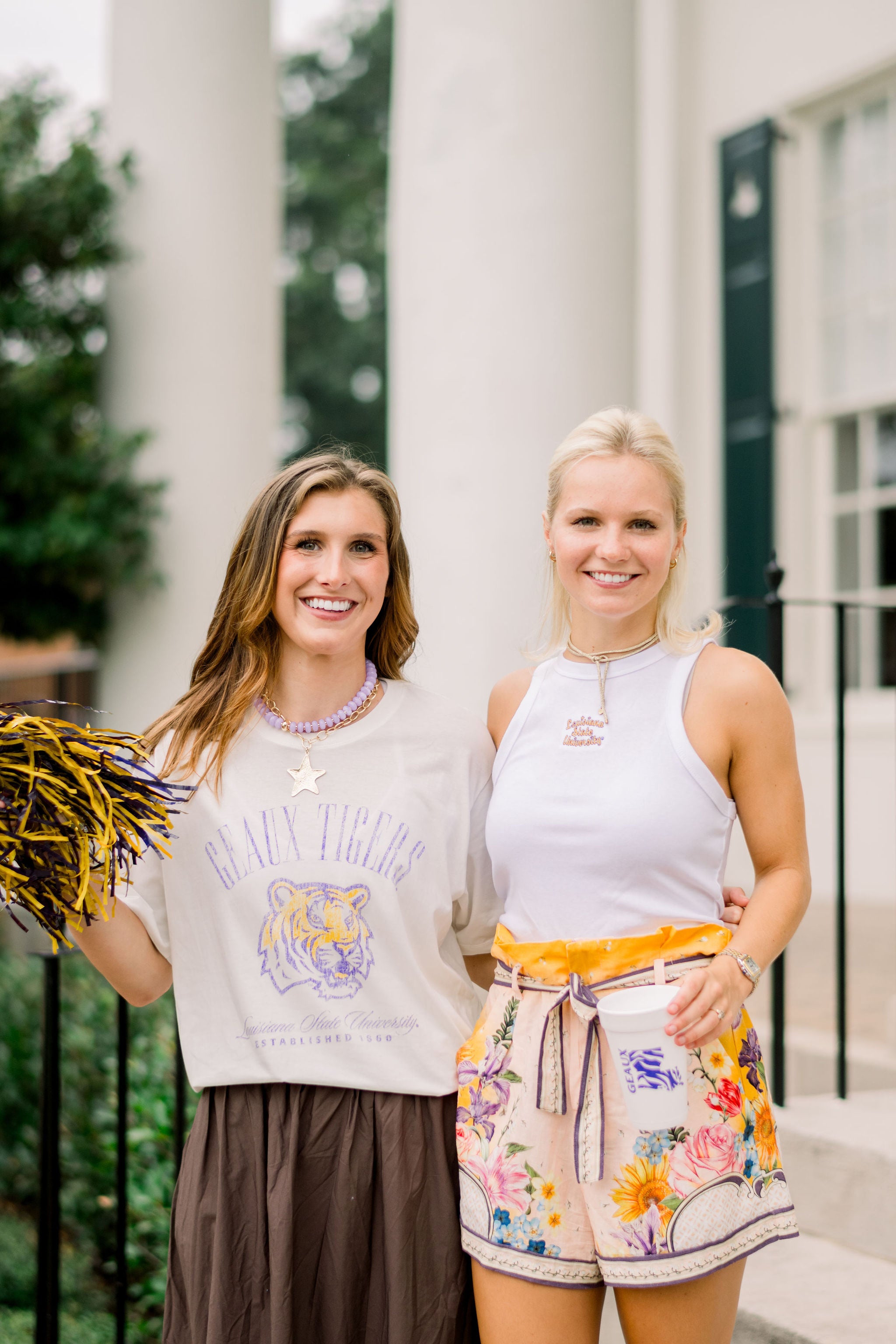Louisiana State University Ivory T-Shirt with Purple text “Geaux Tigers” above a growling Bengal tiger