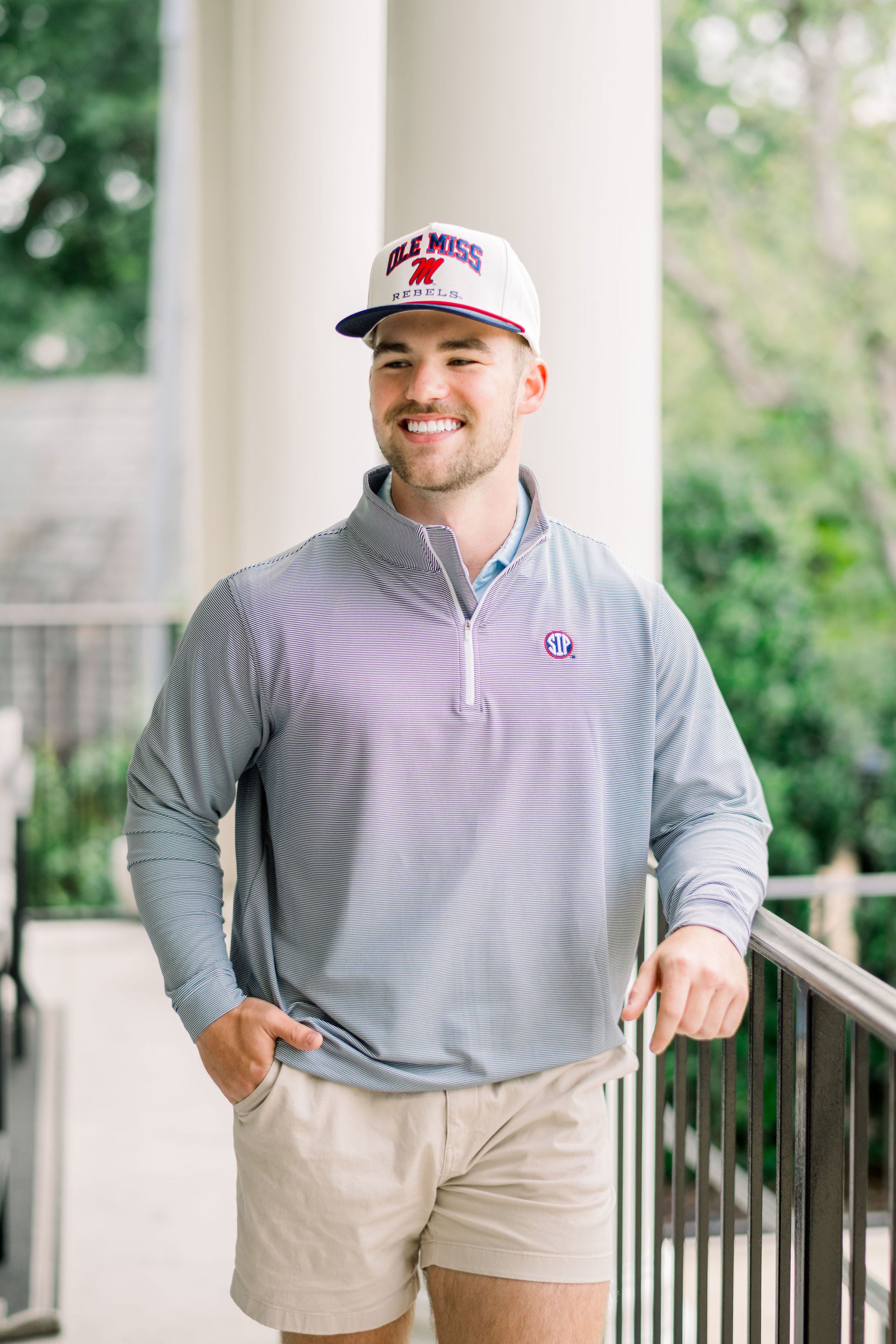 Ole Miss Navy Stripe ¼ Zip Pullover with the SIP Circle Logo embroidered on the left chest