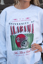  University of Alabama 1992 National Champions Gildan Ash Sweatshirt  with a graphic print of a football helmet and the text '1992 National Champions UNIVERSITY OF ALABAMA'. 