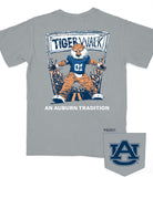 Auburn University Aubie Tiger Walk Granite Comfort Colors T-Shirt with an image of Aubie the Tiger leading a parade under a banner with the text "Tiger Walk"