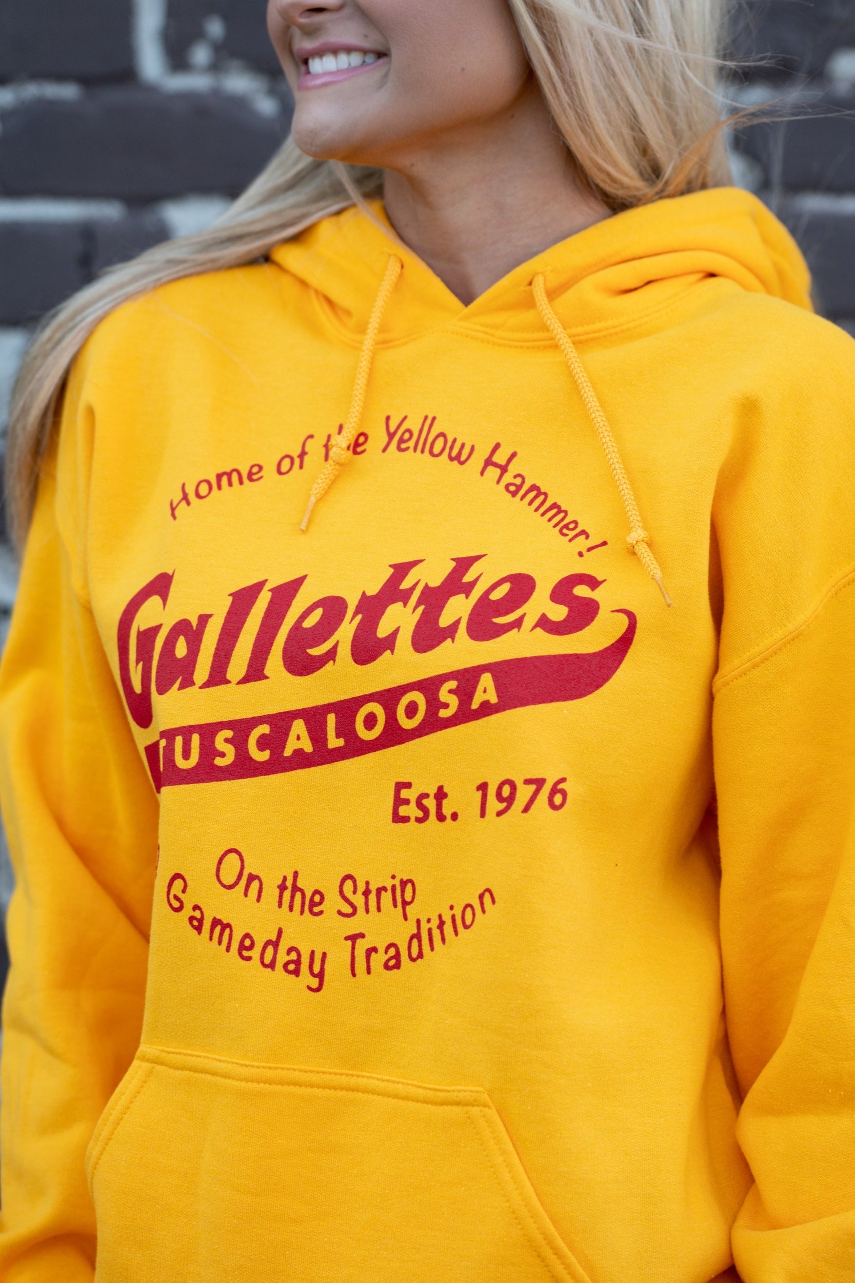 Gallettes Yellow Hoodie with a Red Gallettes logo surrounded by Red text "Home of the Yellow Hammer!" and "On the Strip gameday Tradition"